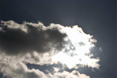 Cloud with the sun behind it Stock Photo - Budget Royalty-Free & Subscription, Code: 400-04570940