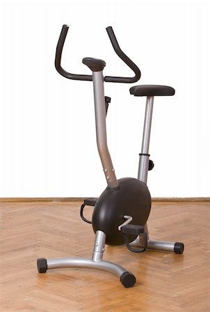 simsearch:400-07627460,k - Fitness bicycle on a parquet floor in a gym. Photographie de stock - Aubaine LD & Abonnement, Code: 400-04571376