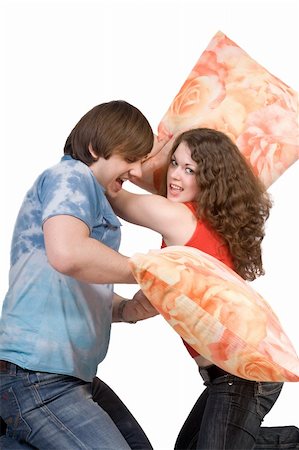The young couple fights pillows. Isolated Photographie de stock - Aubaine LD & Abonnement, Code: 400-04571477
