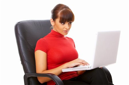 simsearch:400-04562604,k - Businesswoman working on her laptop while sitting on chair Photographie de stock - Aubaine LD & Abonnement, Code: 400-04571505