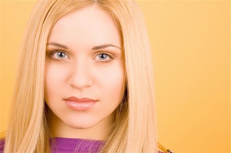 simsearch:400-04780842,k - a pretty looking blonde  girl in a violet sweater Stock Photo - Budget Royalty-Free & Subscription, Code: 400-04571519