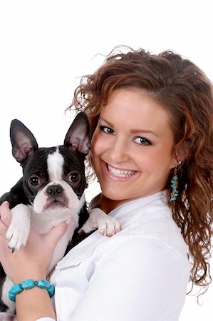 dogs with jewelry - Pretty teenage girl holding a small black and white dog. Stock Photo - Budget Royalty-Free & Subscription, Code: 400-04571606