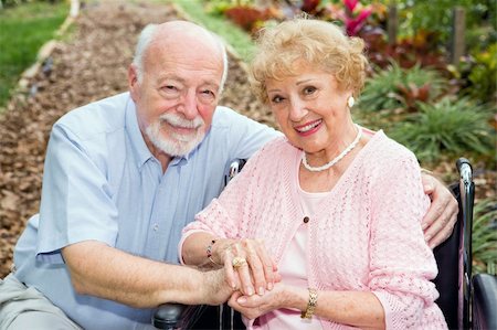 simsearch:400-04065020,k - Beautiful senior couple outdoors.  The wife is in a wheelchair. Foto de stock - Royalty-Free Super Valor e Assinatura, Número: 400-04571628