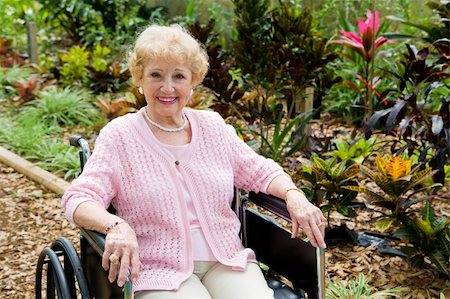 Beautiful disabled senior woman in the garden.   Horizontal view with room for text. Stock Photo - Budget Royalty-Free & Subscription, Code: 400-04571636