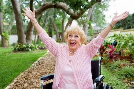 Senior lady in wheelchair is ecstatic as she celebrates freedom from pain. Stock Photo - Budget Royalty-Free & Subscription, Code: 400-04571630