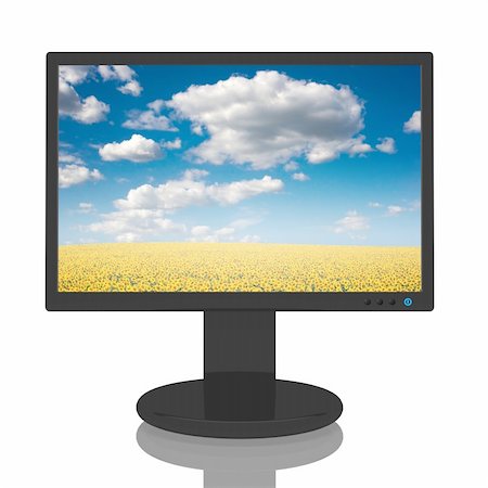 simsearch:400-04086261,k - Computer monitor with a beautiful image of a field of sunflowers. Photographie de stock - Aubaine LD & Abonnement, Code: 400-04571813