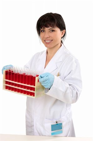 simsearch:400-04548222,k - Medical pathologist, scientist or chemist carrying a rack of test tubes. Stockbilder - Microstock & Abonnement, Bildnummer: 400-04572764