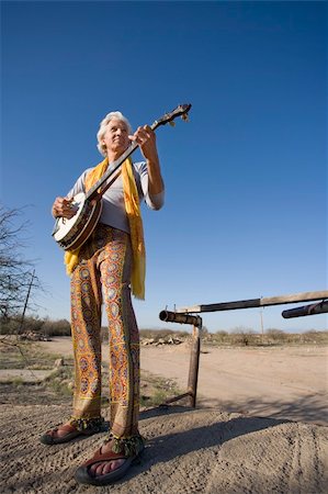 Banjo player standing against the blue sky Stock Photo - Budget Royalty-Free & Subscription, Code: 400-04572963