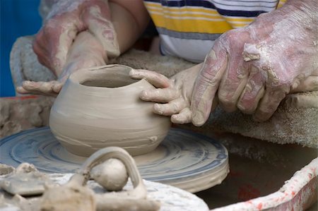Potter's hands helping young student in pottery Stock Photo - Budget Royalty-Free & Subscription, Code: 400-04572977