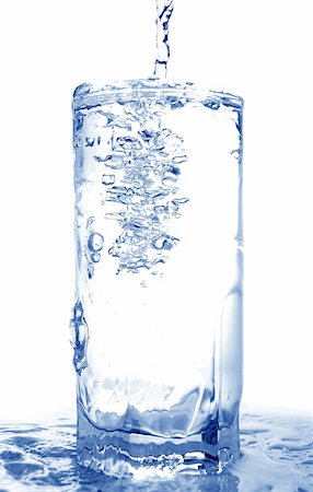 simsearch:400-05129645,k - Big long drop of cold water poured into full glass (isolated on white background) Stock Photo - Budget Royalty-Free & Subscription, Code: 400-04573118