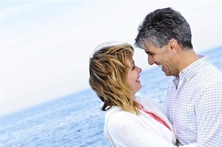 Portrait of mature romantic couple at seashore Stock Photo - Budget Royalty-Free & Subscription, Code: 400-04573226