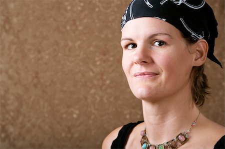 Pretty Woman Wearing a Bandana on Her Head Fotografie stock - Microstock e Abbonamento, Codice: 400-04573283