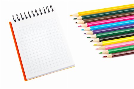 simsearch:400-03947012,k - Blank notebook and assortment of coloured pencils with shadow on white background. Shallow depth of field Stock Photo - Budget Royalty-Free & Subscription, Code: 400-04573707