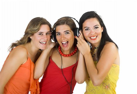 Portrait of three happy girls listening music Stock Photo - Budget Royalty-Free & Subscription, Code: 400-04573726