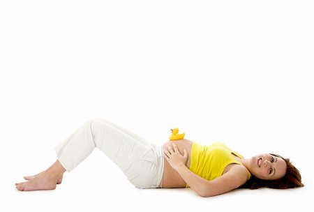 simsearch:400-04570075,k - Beautiful pregnant woman with a rubber duck on her tummy Stock Photo - Budget Royalty-Free & Subscription, Code: 400-04573748