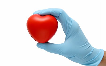 hand in latex blue gloves holding a toy heart isolated in white Stock Photo - Budget Royalty-Free & Subscription, Code: 400-04573798