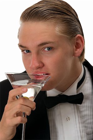 Handsome young man drinking martini Photographie de stock - Aubaine LD & Abonnement, Code: 400-04584546