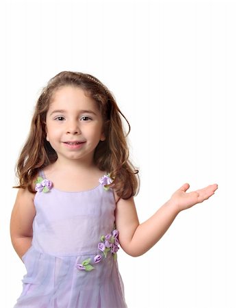 simsearch:400-05131187,k - Beautiful smiling girl standing with one hand outstretched. with copyspace. Stock Photo - Budget Royalty-Free & Subscription, Code: 400-04585123