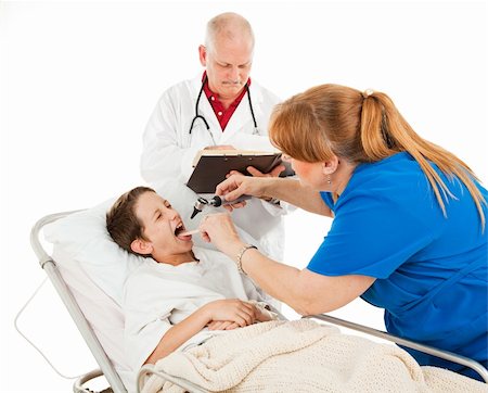 patient on bed and iv - Little boy doesn't like having his throat examined in the hospital.  Isolated on white. Stock Photo - Budget Royalty-Free & Subscription, Code: 400-04585460