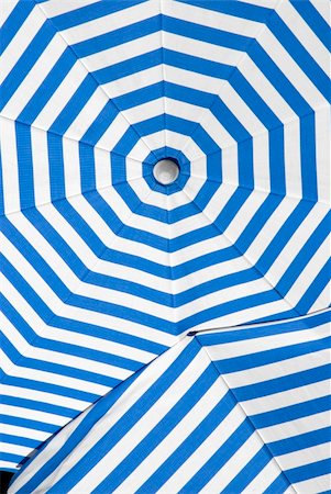 stockarch (artist) - overlapping sun shade umbrellas with white and blue stripes Foto de stock - Royalty-Free Super Valor e Assinatura, Número: 400-04586071