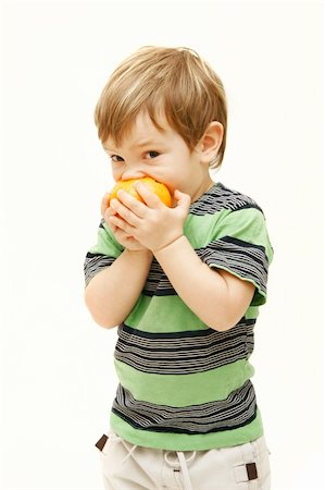 simsearch:400-04979626,k - young boy eating orange over white Foto de stock - Super Valor sin royalties y Suscripción, Código: 400-04586320