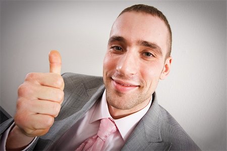 Young businessman showing thumbs up Stock Photo - Budget Royalty-Free & Subscription, Code: 400-04586696