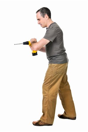 simsearch:400-08054637,k - Strong handyman pushing on his cordless drill Stock Photo - Budget Royalty-Free & Subscription, Code: 400-04587209