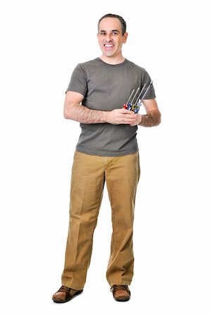 simsearch:400-04021777,k - Smiling handyman holding a bunch of screwdrivers Foto de stock - Royalty-Free Super Valor e Assinatura, Número: 400-04587210