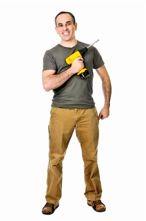 simsearch:400-04021777,k - Smiling handyman ready to work holding a drill Foto de stock - Royalty-Free Super Valor e Assinatura, Número: 400-04587213