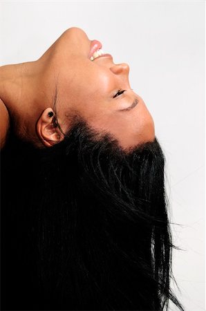 smiling young latina models - Portrait of young african american woman with long hair - isolated Foto de stock - Super Valor sin royalties y Suscripción, Código: 400-04587420