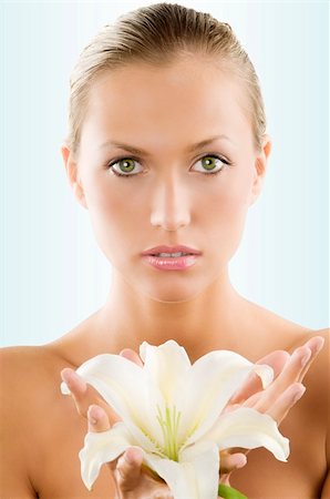 simsearch:400-04323317,k - fresh portrait of a young and beautiful woman with a white lily and wet hair Stock Photo - Budget Royalty-Free & Subscription, Code: 400-04587758