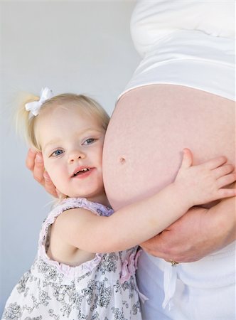 sister hugs baby - Little Girl Hugging New Sibling to Be Stock Photo - Budget Royalty-Free & Subscription, Code: 400-04587777