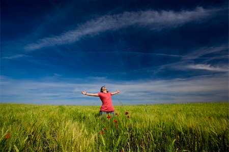 beautiful young woman with arms wide open happy in the nature Stockbilder - Microstock & Abonnement, Bildnummer: 400-04588650