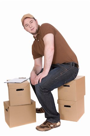 simsearch:400-04149768,k - delivery man with a package isolated on white background Photographie de stock - Aubaine LD & Abonnement, Code: 400-04588797
