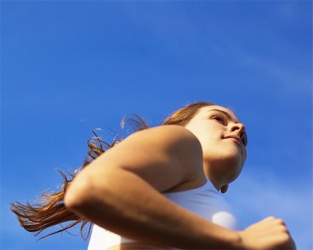 Beautiful young woman runner having a workout session. Stock Photo - Budget Royalty-Free & Subscription, Code: 400-04589021