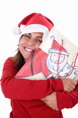 simsearch:400-04231102,k - happy young santa woman in red clothing holding present bag in her hands. isolated on white background. Photographie de stock - Aubaine LD & Abonnement, Code: 400-04589095