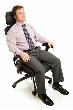 ergonomic - Businessman sitting in ergonomic executive chair. Stock Photo - Budget Royalty-Free & Subscription, Code: 400-04589117