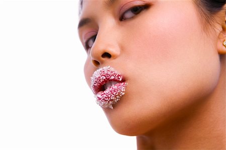 close up portrait of young Asian lady with sensual looking and sugar covered her lips (Notes : focus on lips) Stock Photo - Budget Royalty-Free & Subscription, Code: 400-04589366