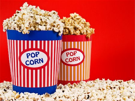 simsearch:400-04913050,k - Two popcorn buckets over a red background. Photographie de stock - Aubaine LD & Abonnement, Code: 400-04589599
