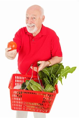 food market old people - Healthy senior man shopping for organic produce and holding out a tomato.  Isolated. Stock Photo - Budget Royalty-Free & Subscription, Code: 400-04582466