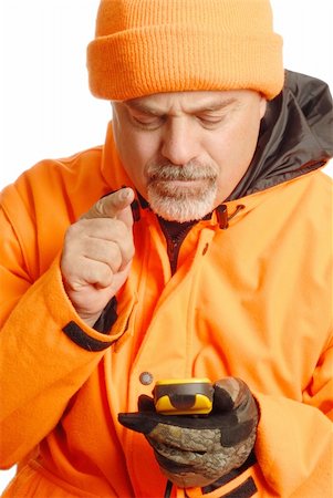 man looking for coordinates on gps wearing blaze orange hunting gear Stock Photo - Budget Royalty-Free & Subscription, Code: 400-04582618