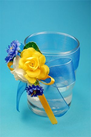 glasses with flowers isolated  on blue Stock Photo - Budget Royalty-Free & Subscription, Code: 400-04582934