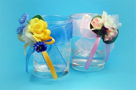 glasses with flowers isolated  on blue Stock Photo - Budget Royalty-Free & Subscription, Code: 400-04582936