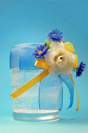 glasses with flowers isolated  on blue Stock Photo - Budget Royalty-Free & Subscription, Code: 400-04582931