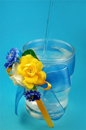 glasses with flowers isolated  on blue Stock Photo - Budget Royalty-Free & Subscription, Code: 400-04582933