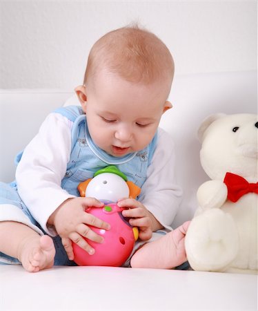 Portrait of cute newborn playing with toys Stock Photo - Budget Royalty-Free & Subscription, Code: 400-04583199