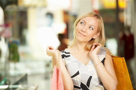 simsearch:400-07169053,k - The blonde in shop with purchases looks aside Stockbilder - Microstock & Abonnement, Bildnummer: 400-04583515