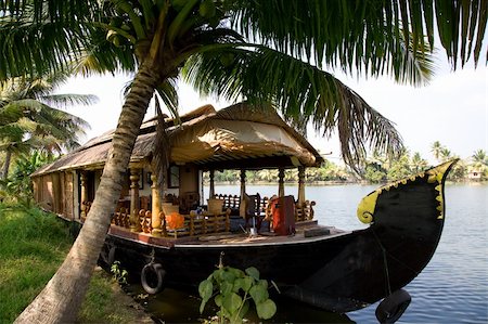 House boat in India over tropical palm on the river Stock Photo - Budget Royalty-Free & Subscription, Code: 400-04583625