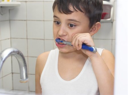 young boy brushing his teeth Stock Photo - Budget Royalty-Free & Subscription, Code: 400-04595112