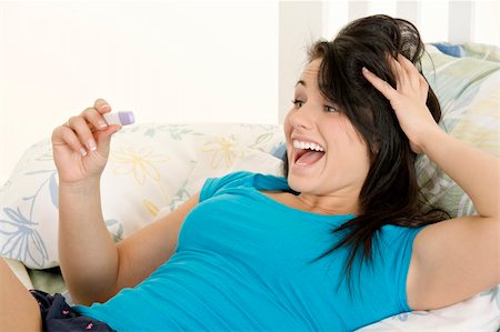 pregnant teen girl - Young Caucasian woman looking at pregnancy test Stock Photo - Budget Royalty-Free & Subscription, Code: 400-04595720